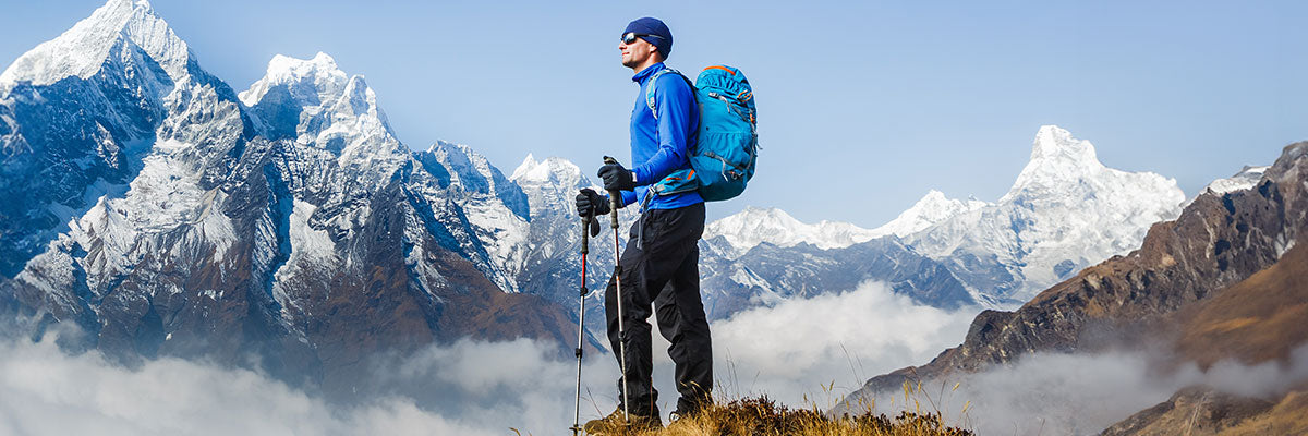 Man hiking mountain with good quality hiking gear